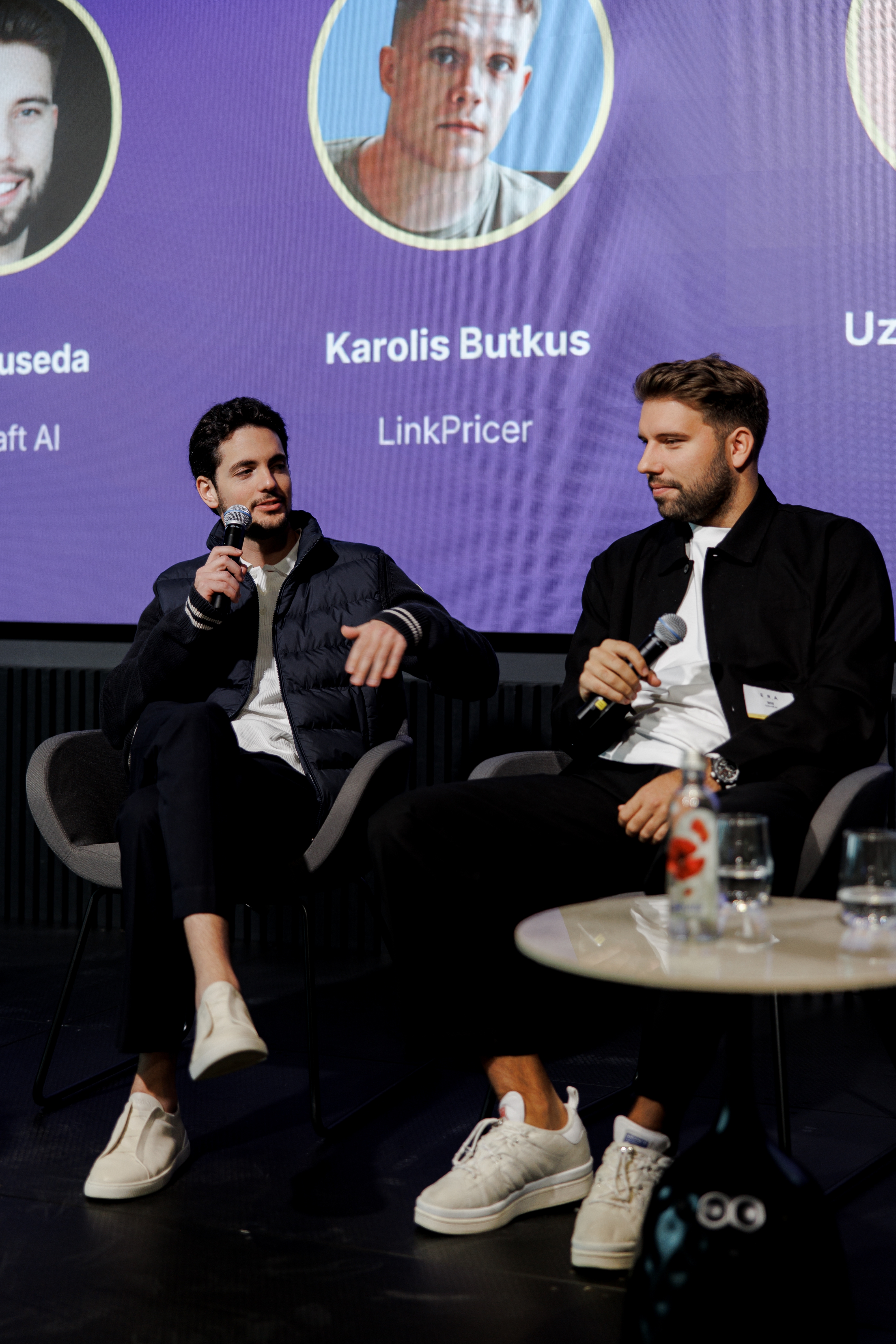 Speakers on stage during a panel discussion